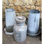 A vintage milk churn, 54cmH; together with two poultry feeders