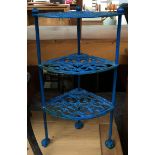 A Le Creuset style cast iron corner pan stand, 63cmH