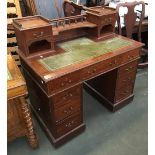 A 20th century pedestal desk, galleried superstructure with two pier drawers, tooled leather skiver,