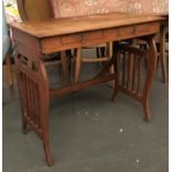 A 20th century oak occasional table, with two drawers and stylised lyre supports, 83x45x71