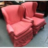A pair of wingback armchairs, each with loose cover and cushion, on cabriole front legs
