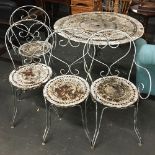 A good set of French wrought iron garden chairs and table, the table 96cmD