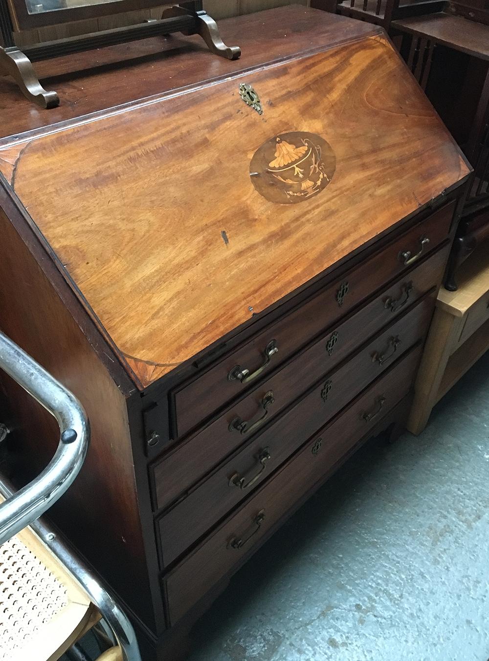 A mid-18th century mahogany and marquetry bureau, fall front above four graduating drawers, on