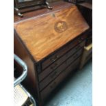 A mid-18th century mahogany and marquetry bureau, fall front above four graduating drawers, on