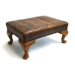 A leather upholstered footstool on cabriole legs, 54x38x24cmH
