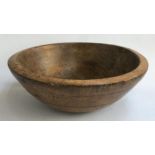 A large turned wooden fruit bowl (worm damage), 42cmD