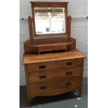 A 20th century light oak dressing table/chest of drawers, bevelled mirror with two small drawers