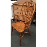 A 20th century Windsor chair with pierced splats, on turned front supports, shaped seat, turned legs