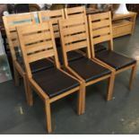 A set of six light oak and vinyl dining chairs