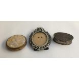 A small silver dressing table pot; enamel and glass set oval picture frame; and a compact (3)