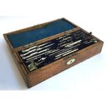 A 19th century mahogany cased set of drawing instruments with fitted interior, the box 37x16x10cmH
