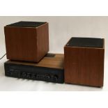 A pair of Sonab of Sweden OD11 speakers; together with a Rotel stereo receiver RX-402