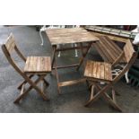 A pair of folding garden chairs and matching table