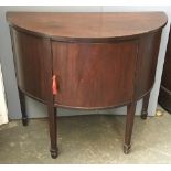 A 19th century mahogany demilune side table/cupboard, with single drawer on square tapered legs