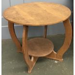 A circular oak occasional table, with undershelf, 77cmD, 62cmH