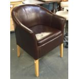 A modern brown vinyl tub chair