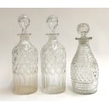 A pair of 19th century cut glass decanters, 26cmH; together with one other