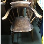 A 19th century smokers bow chair or Captains chair, on turned supports with double H stretcher