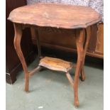 A small oak occasional table, shaped top on cabriole legs, 66x45x73cmH