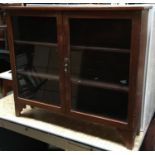 A small glazed mahogany bookcase of three shelves, on bracket feet, 90x21x78cmH