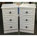 A pair of contemporary bedside cabinets of three drawers in white, 40x40x70cm