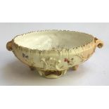 A Royal Worcester hand painted blush ivory ornate footed bowl, with floral decoration heightened