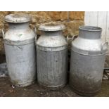 Three aluminium milk pails, approx. 66cmH and 77cmH