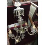 A glass five arm chandelier with cut glass drops, one arm broken