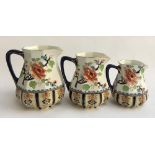 A set of three graduating Losolware Shanghai jugs, the largest with handle repaired 19cmH