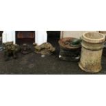 A collection of various garden figures, chimney pot etc