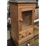 A modern pine cabinet, single glazed door above two drawers on plinth base, 46x45x85cm; together