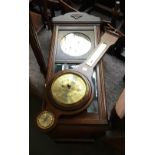 An oak cased wall clock, with pendulum and key, 76cmH; together with a West German banjo