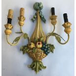 A decorative wall sconce, in the form of a bowl of fruit and acanthus leaves, adapted for electrical