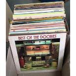 A mixed box of vinyl LPs, to include The Doobies, Village People, Dr Hook, The Chieftains, Beach