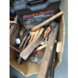 A box of various hand tools, including spanner, files, hammers, hammer drill etc