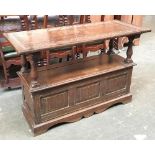 A 20th century oak metamorphic monk's bench/table, with hinged seat opening, 122x51x80cmH
