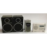 A Roberts Ecologic DAB portable radio; a boxed Roberts 3 band portable radio; and a pair of Goodmans