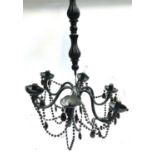 A black plastic Venetian six arm chandelier