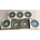 A collection of seven Wedgwood Jasperware Christmas plates, 1975-81, all boxed