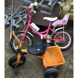 A pink Raleigh child's bicycle; together with a tricycle