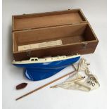 A Triang Penguin pond yacht in wooden box