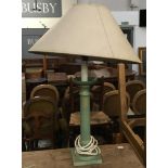 A copper effect wood turned table lamp, with shade, the base 33cmH, 60cm to top of shade