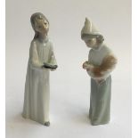 Two Lladro figurines, girl with candlestick and girl with chicken, each approx. 20cmH