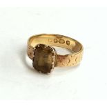 Pretty 18ct gold ring set with a citrine on an engraved band, gross weight 2.9g,size L
