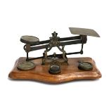 A vintage set of postal scales, with four weights