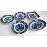 A Copeland Spode blue and white part dinner service decorated with green and yellow flowers,