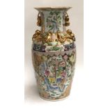 A large 20th century Chinese baluster vase, decorated with panels depicting lotus flowers and