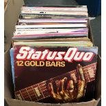 A mixed box of vinyl LPs to include Status Quo, The Beach Boys, The Shadows, some country, various