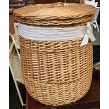 A circular wicker laundry basket, approx. 56cmH