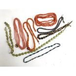 Various bead necklaces including one with a silver clasp set with marcasites, coral necklaces and